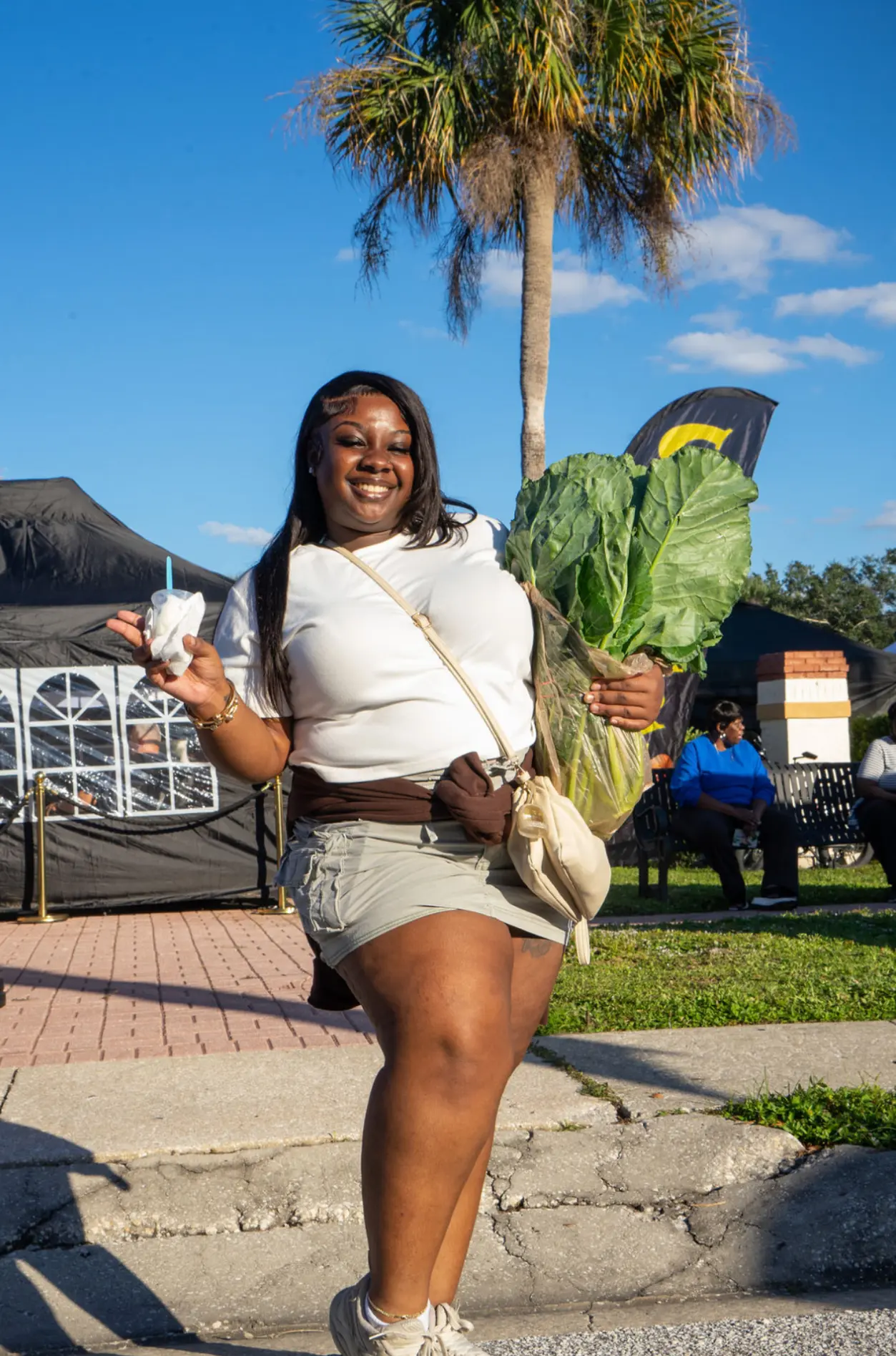 Resident with fresh greens from the market